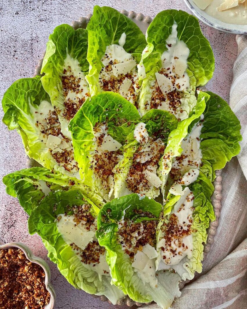 Caesar Salad Boats With Tahini Dressing, Topped With Zaatar Breadcrumbs And Parmesan Bits.
