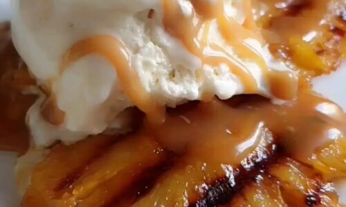Grilled Pineapple Served With Vanilla Icecream And Butterscotch Sauce