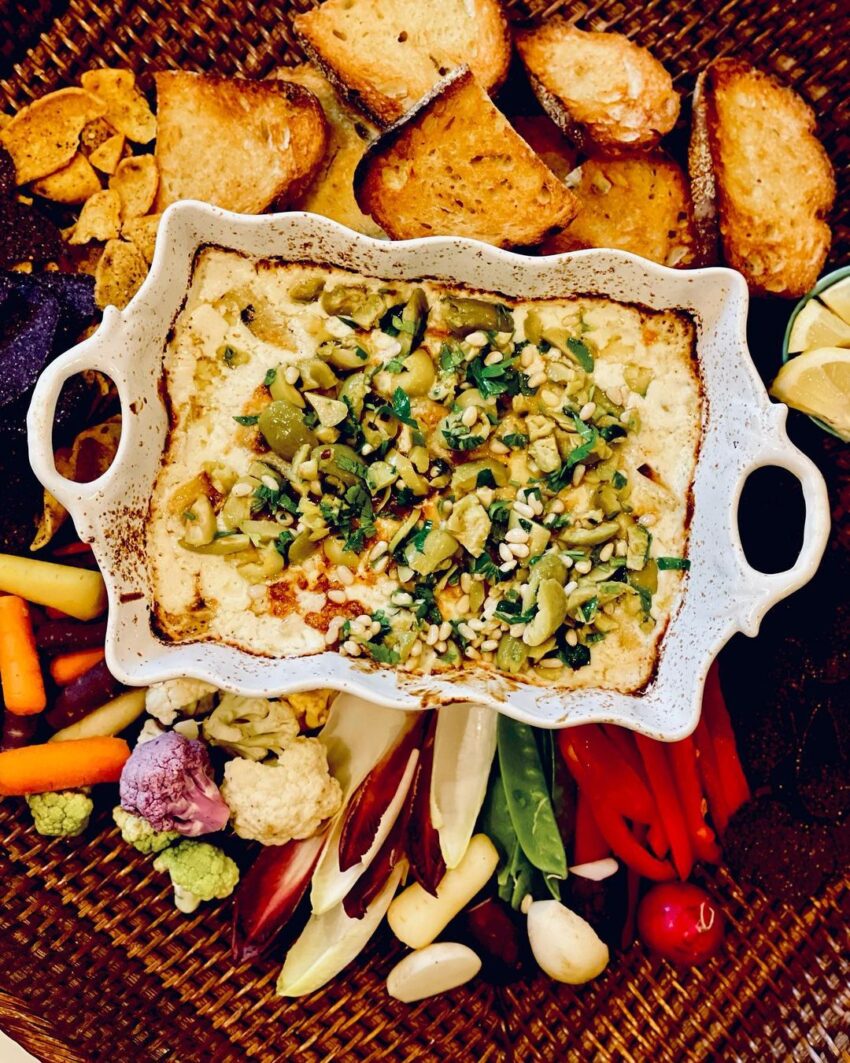Baked Feta Cheese And Artichoke Dip With An Italian Cerniglia Olive