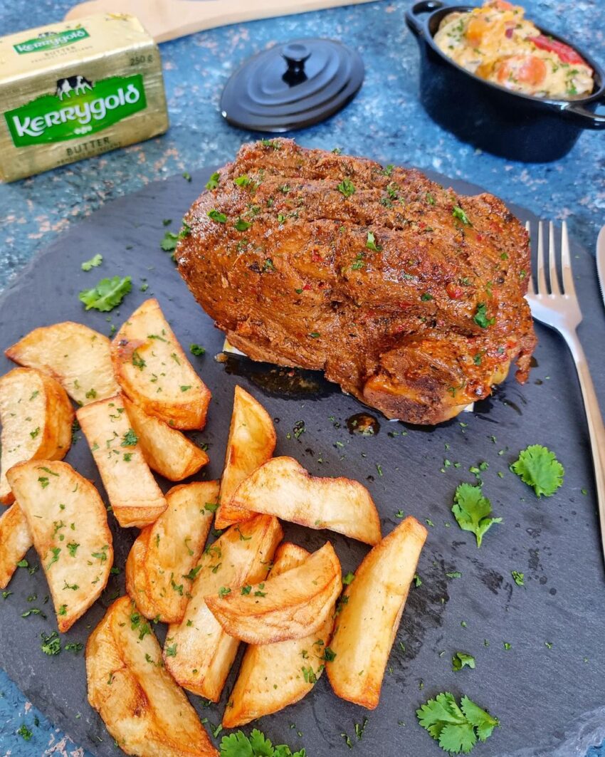 Lamb Roast Served With Creamy Vegetables And Potato Wedges