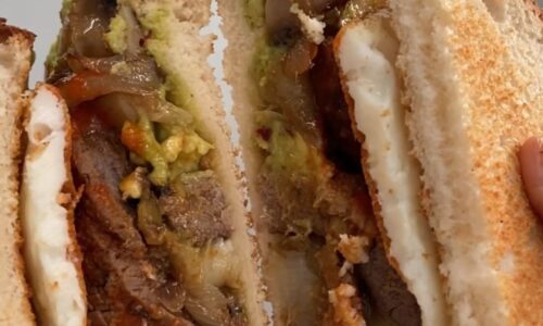 Steak Sandwich With Smashed Avocado, Caramelised Onions And Mushrooms
